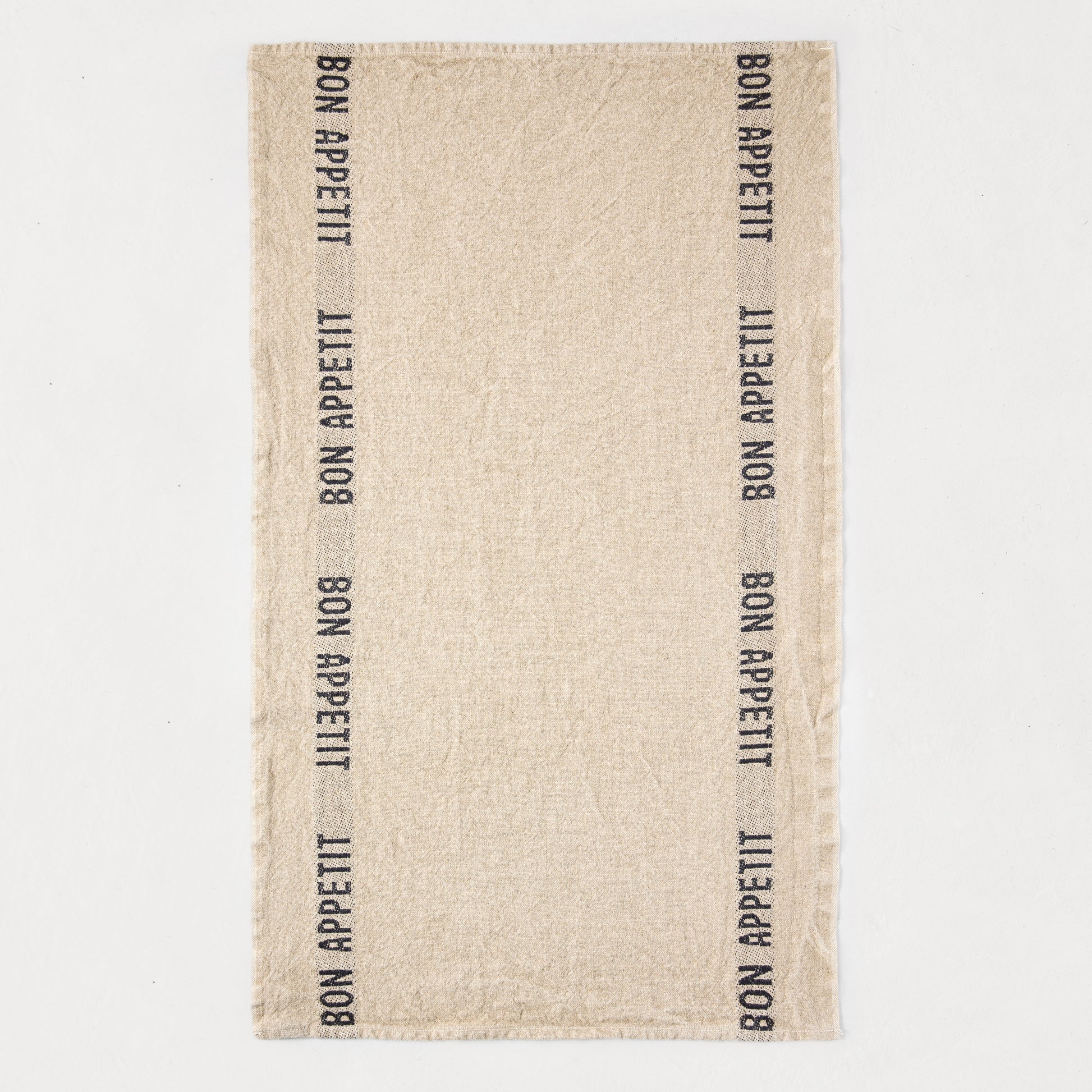 Khaki linen hand towel with "BON APPETIT" printed vertically in black on both sides.