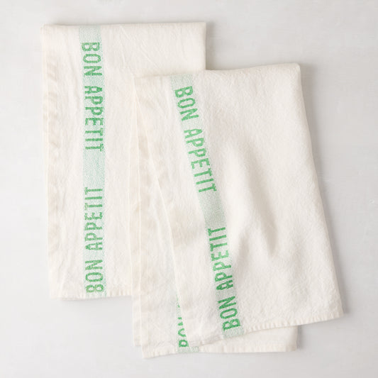 Set of 2 white linen hand towels with a bright green "Bon Appetit" stripe.