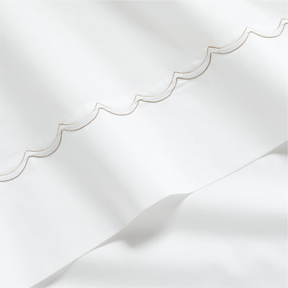 White percale sheet with brown scallop stitch edging.