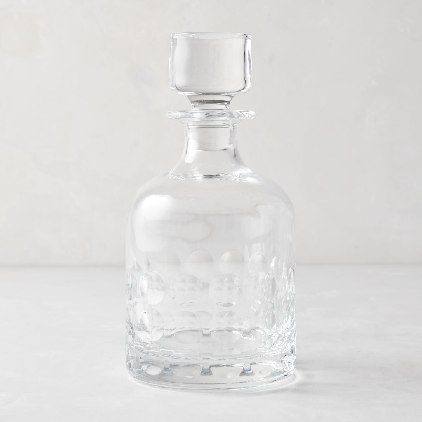 Clear lead-free eco-crystal decanter with a bubble pattern and square stopper.
