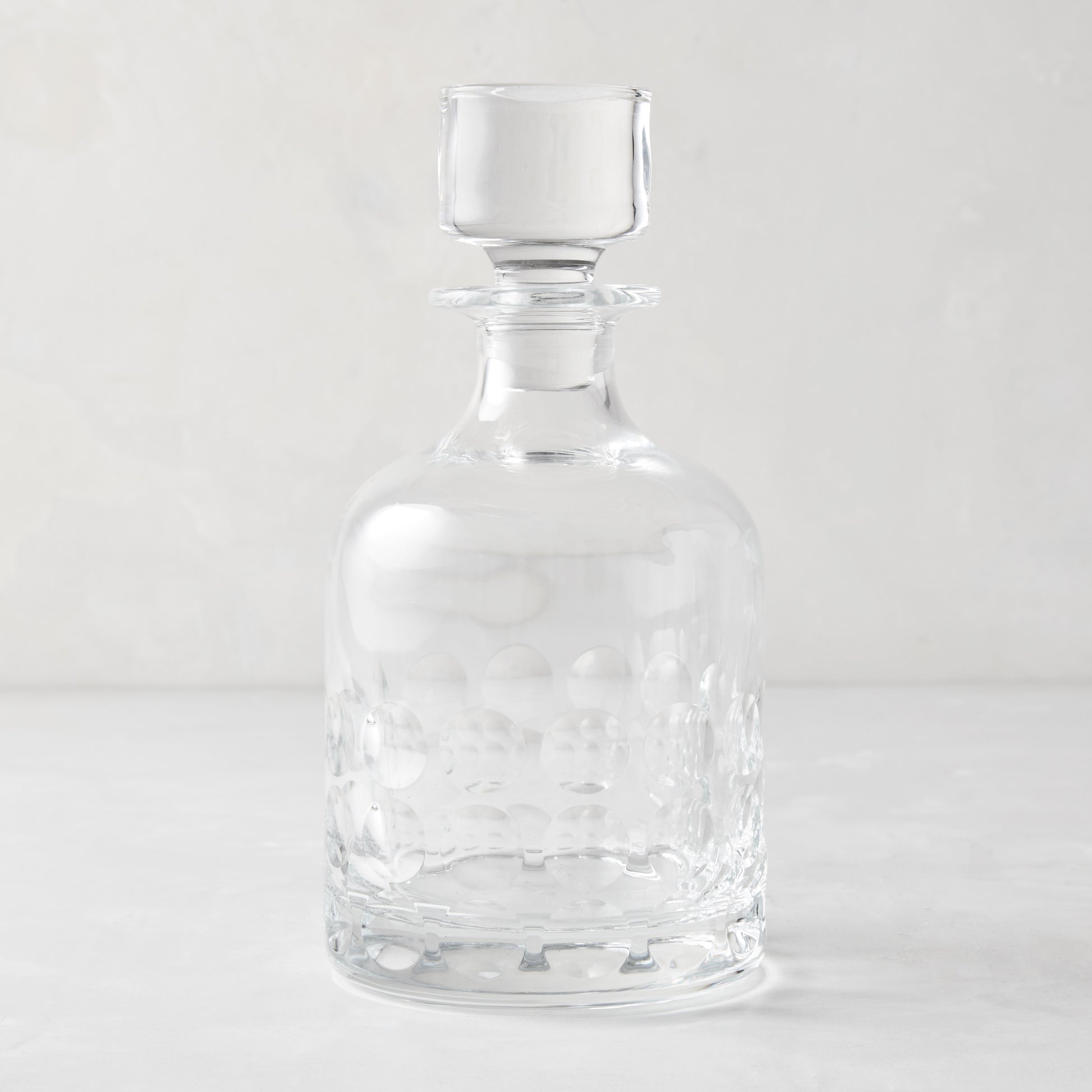Clear lead-free eco-crystal decanter with a bubble pattern and square stopper.