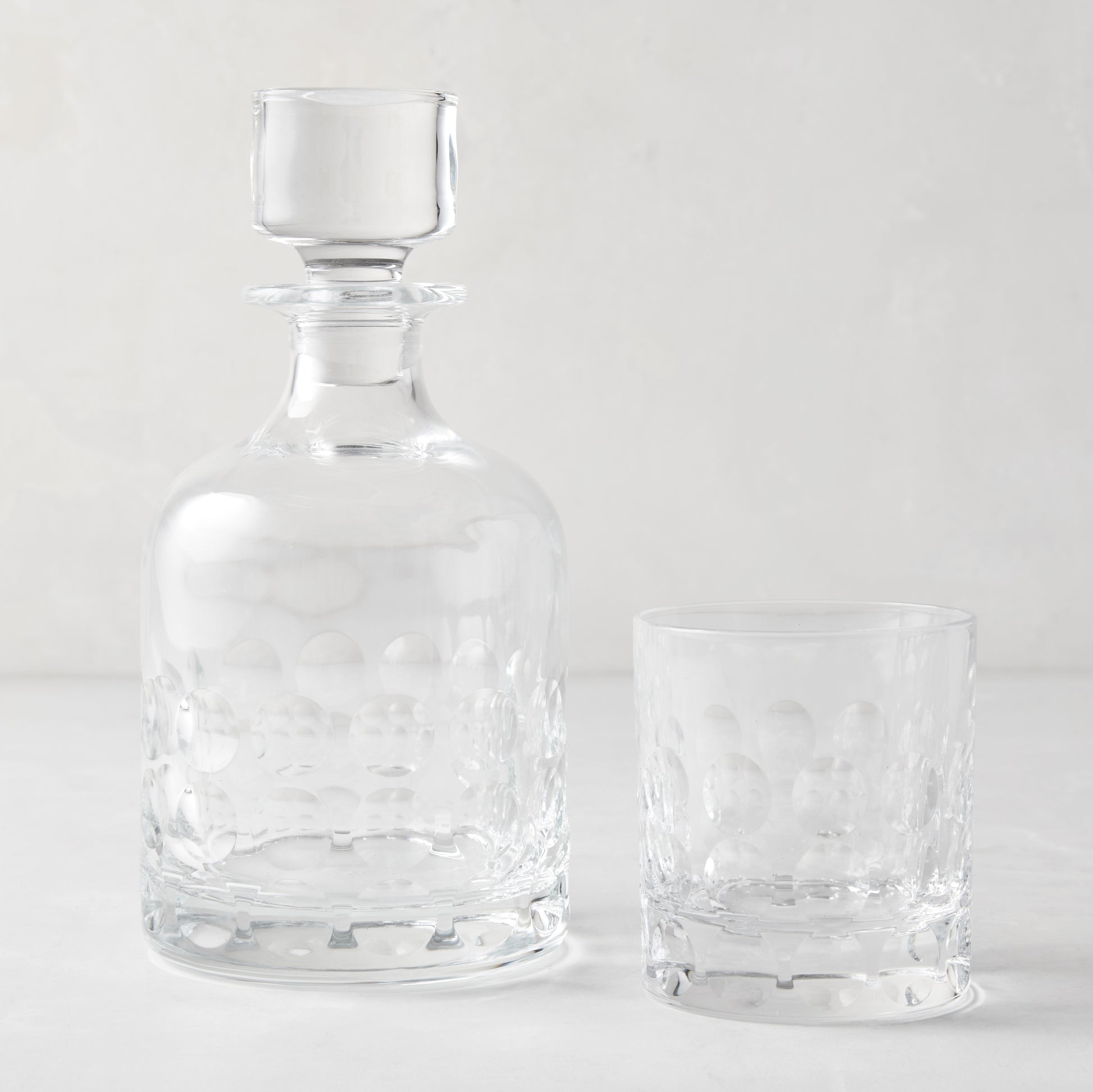 Clear Bubble Eco-Crystal Old Fashioned glass and matching decanter with textured bubble pattern.