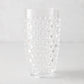 Clear bubble acrylic highball glass, 19oz, with textured dot pattern.