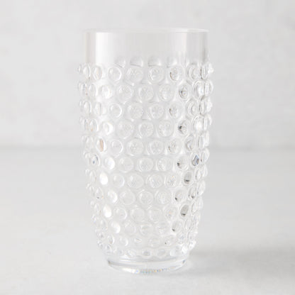 Clear bubble acrylic highball glass, 19oz, with textured dot pattern.