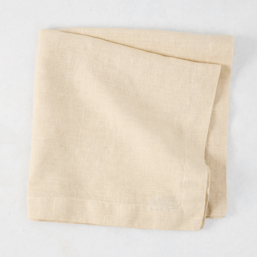 HG Buttermilk Hand-Dyed Linen Napkin, 22", folded, light beige with subtle texture.