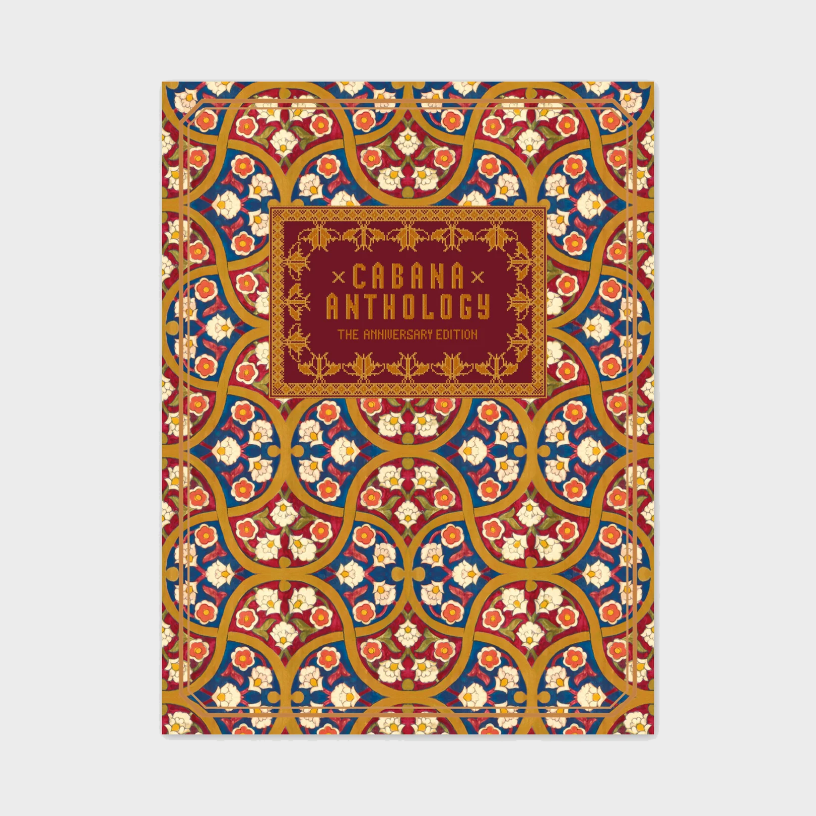 Cabana Anthology hardcover book featuring an intricate red, blue, and gold floral pattern with a central decorative title.