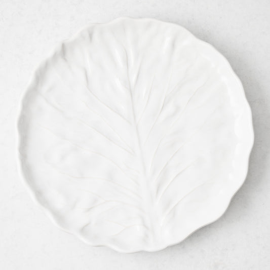 White ceramic dinner plate with a textured cabbage leaf design and glossy finish, 10.6 inches in diameter.