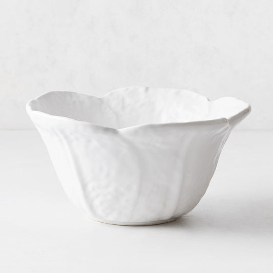 White ceramic serve bowl shaped like cabbage leaves with textured details, 10.6-inch diameter, made in Portugal.