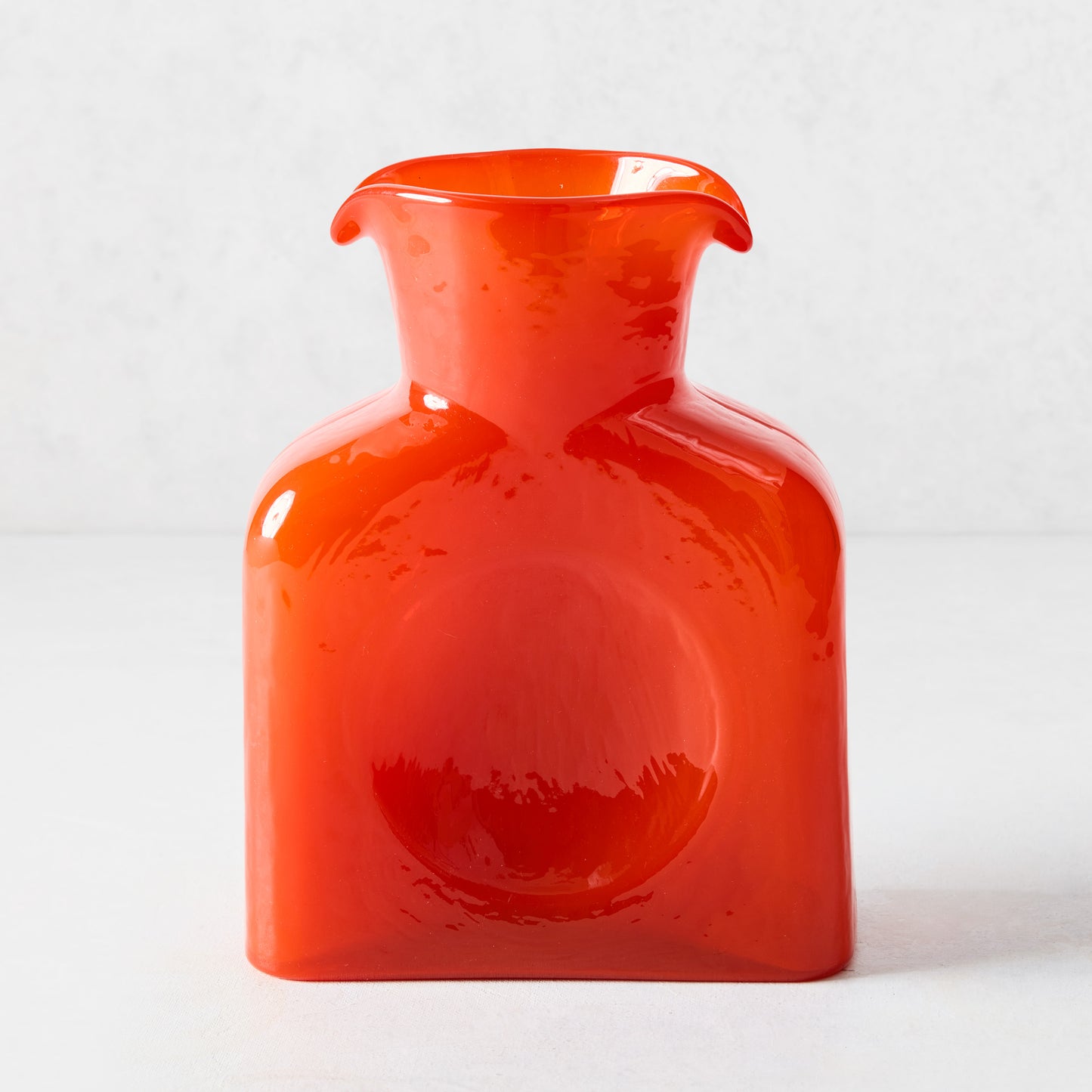 Cabell Orange Square Glass Pitcher, 8"H, with dual spout and side dip.