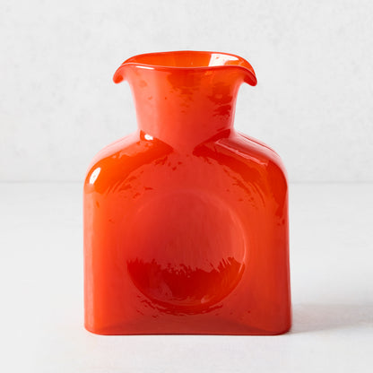 Cabell Orange Square Glass Pitcher, 8"H, with dual spout and side dip.