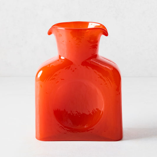 Cabell Orange Square Glass Pitcher, 8"H, with dual spout and side dip.