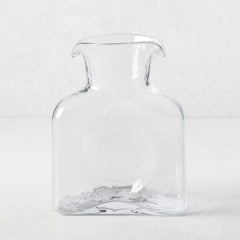 Cabell Square Glass Pitcher, clear hand-blown glass, 8"H, with dual spouts and textured finish.