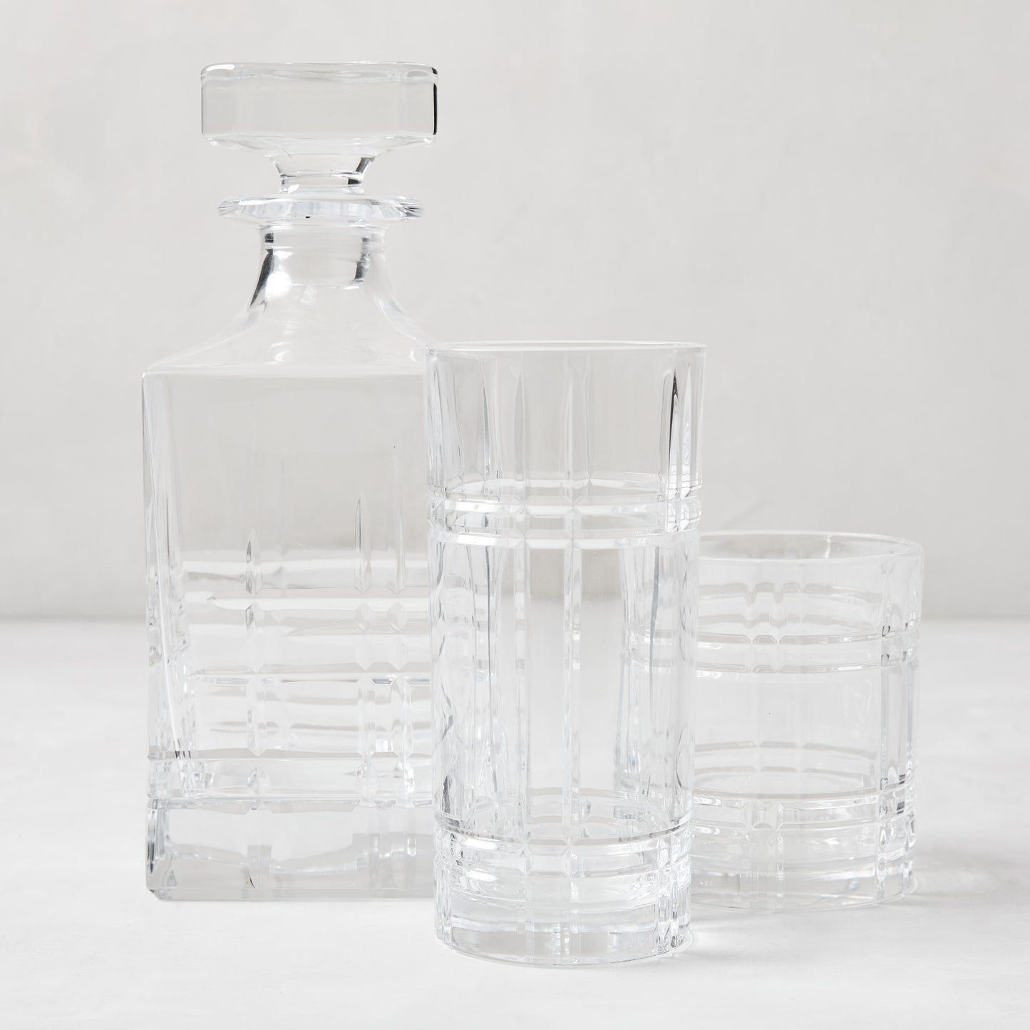 Camden Eco-Crystal Double Old-Fashioned glass, decanter, and highball glass with grid pattern.