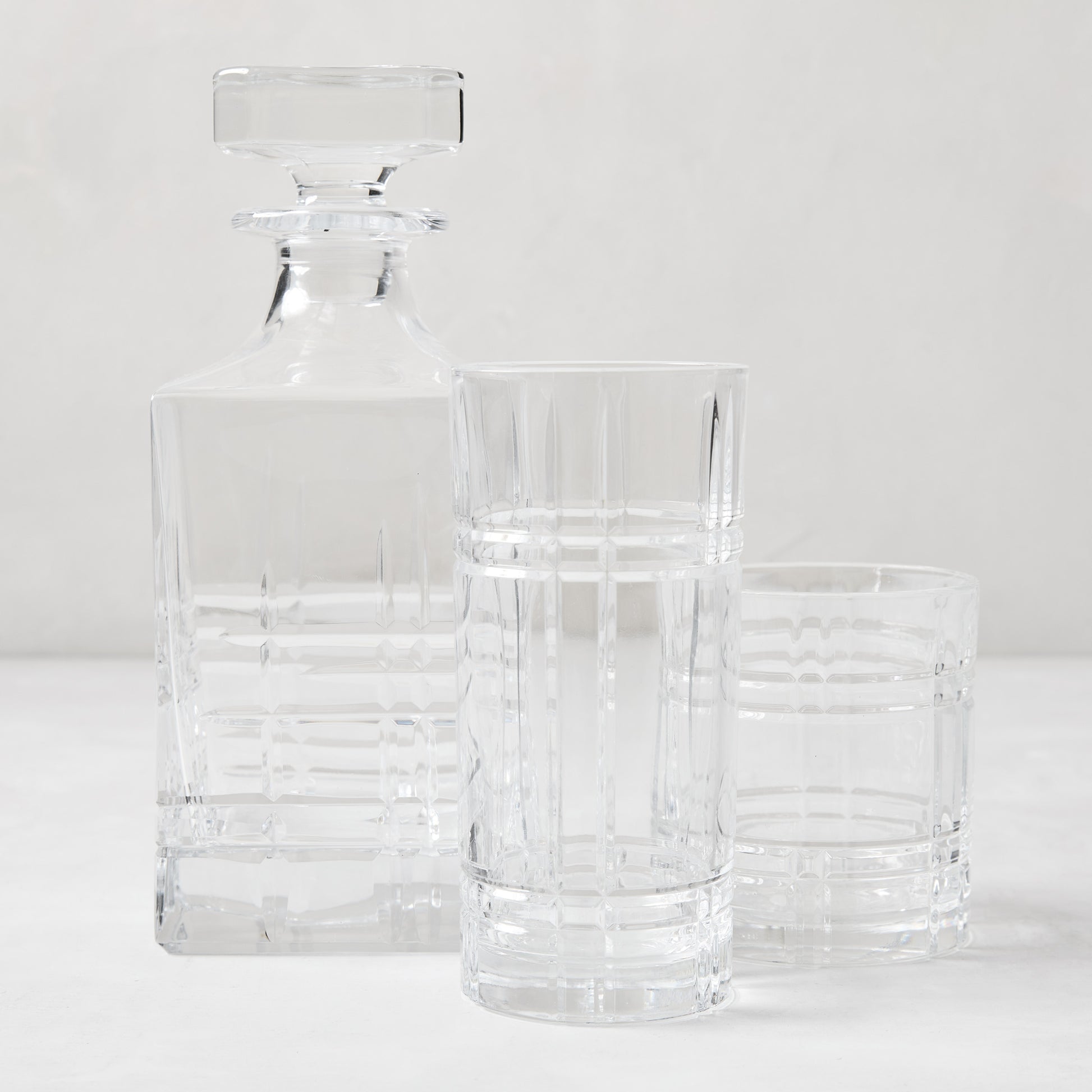 Camden Eco-Crystal Double Old-Fashioned glass, decanter, and highball glass with grid pattern.
