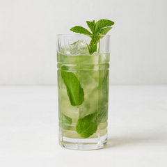 Camden Eco-Crystal High Ball Glass with a green cocktail, ice, and fresh mint garnish.