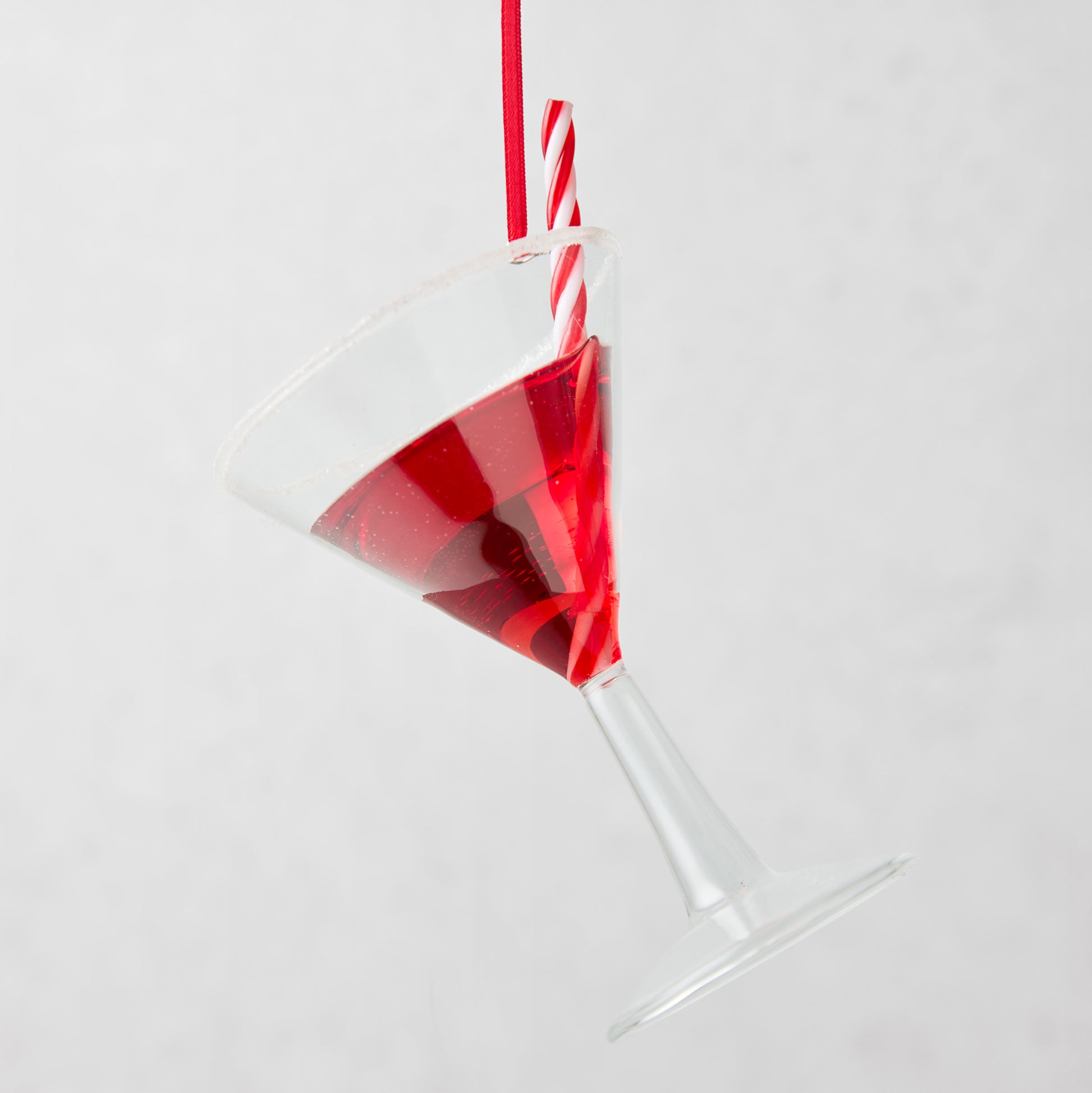 Glass Candy Cane Martini Christmas Tree Ornament with red liquid and striped straw.