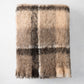 Canterbury Brown Plaid Mohair Throw Blanket, folded, showing fuzzy texture and brown/tan plaid pattern.