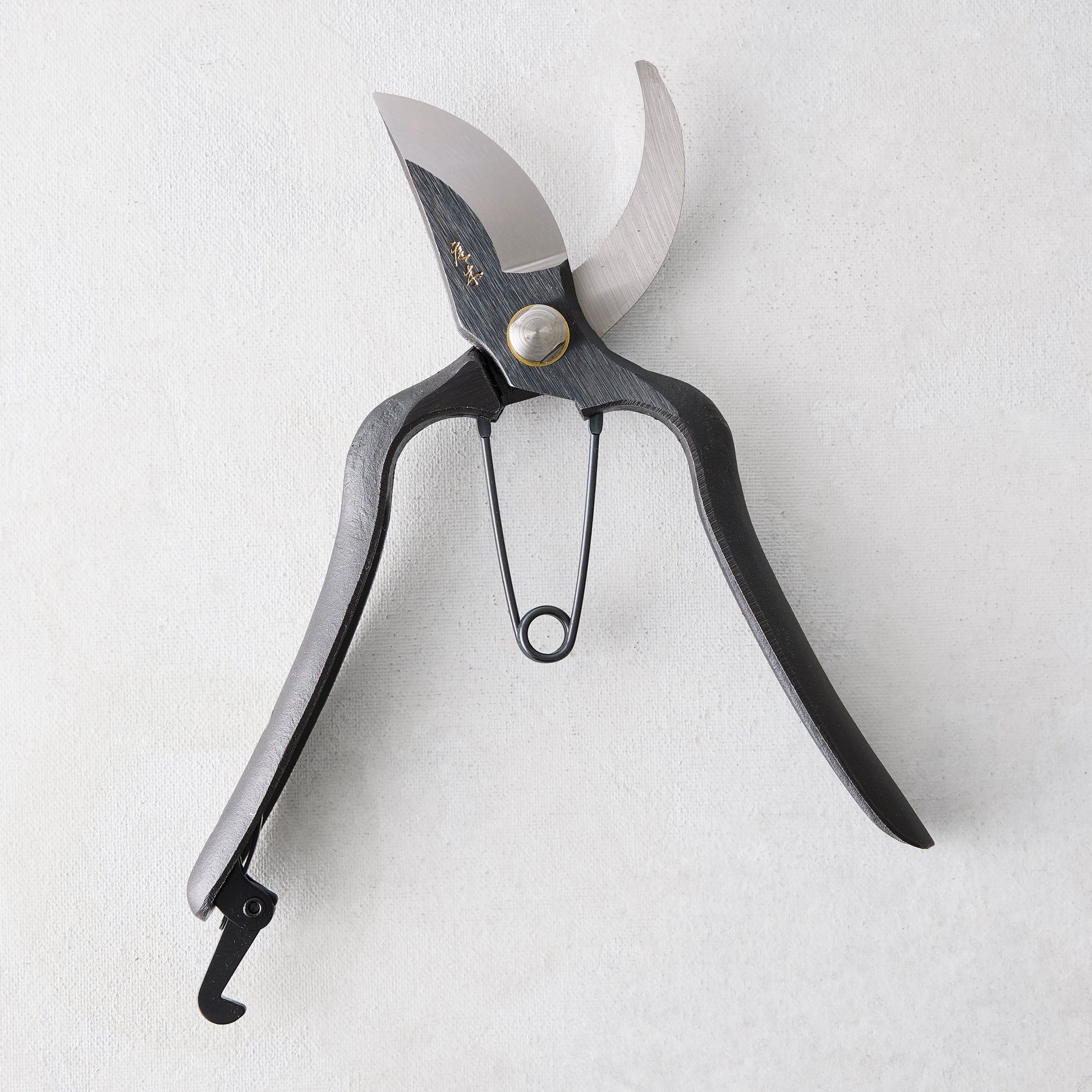 8"L Carbon Steel Sentei Garden Secateurs with black curved handles and silver clam blades.