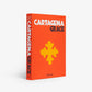 Hardcover book "Cartagena Grace" with orange cover, yellow cross design, and white text.