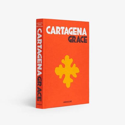 Hardcover book "Cartagena Grace" with orange cover, yellow cross design, and white text.