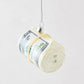 Hand-painted glass and resin cash roll Christmas ornament with glitter accents and a silver hanging loop.