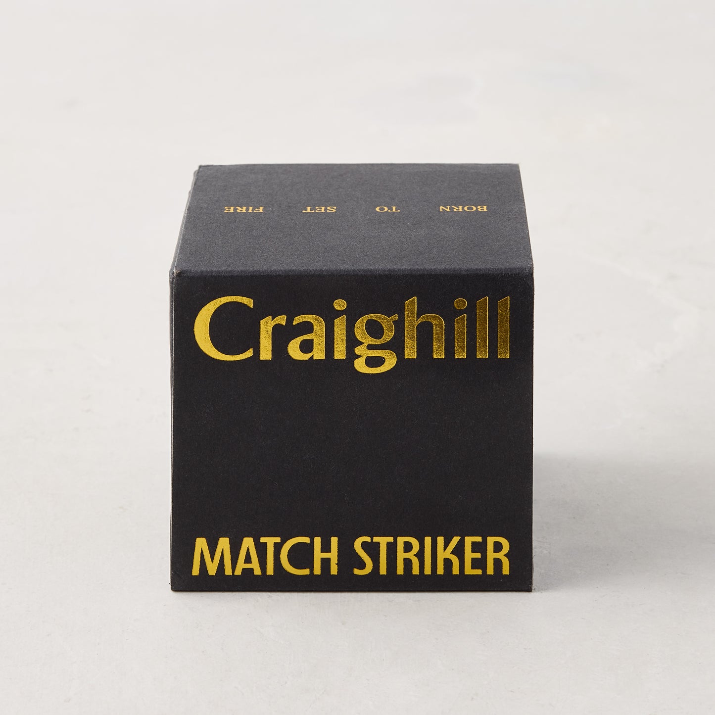 Craighill black match striker box with gold text.