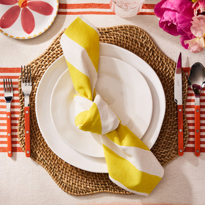 Cebu Scalloped Hapao Placemat, 16" round, honey-brown rattan with a traditional weave and scalloped edge.