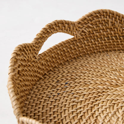 Handcrafted honey-brown rattan Cebu scalloped tray with hapao weave, curved edges, and handles.