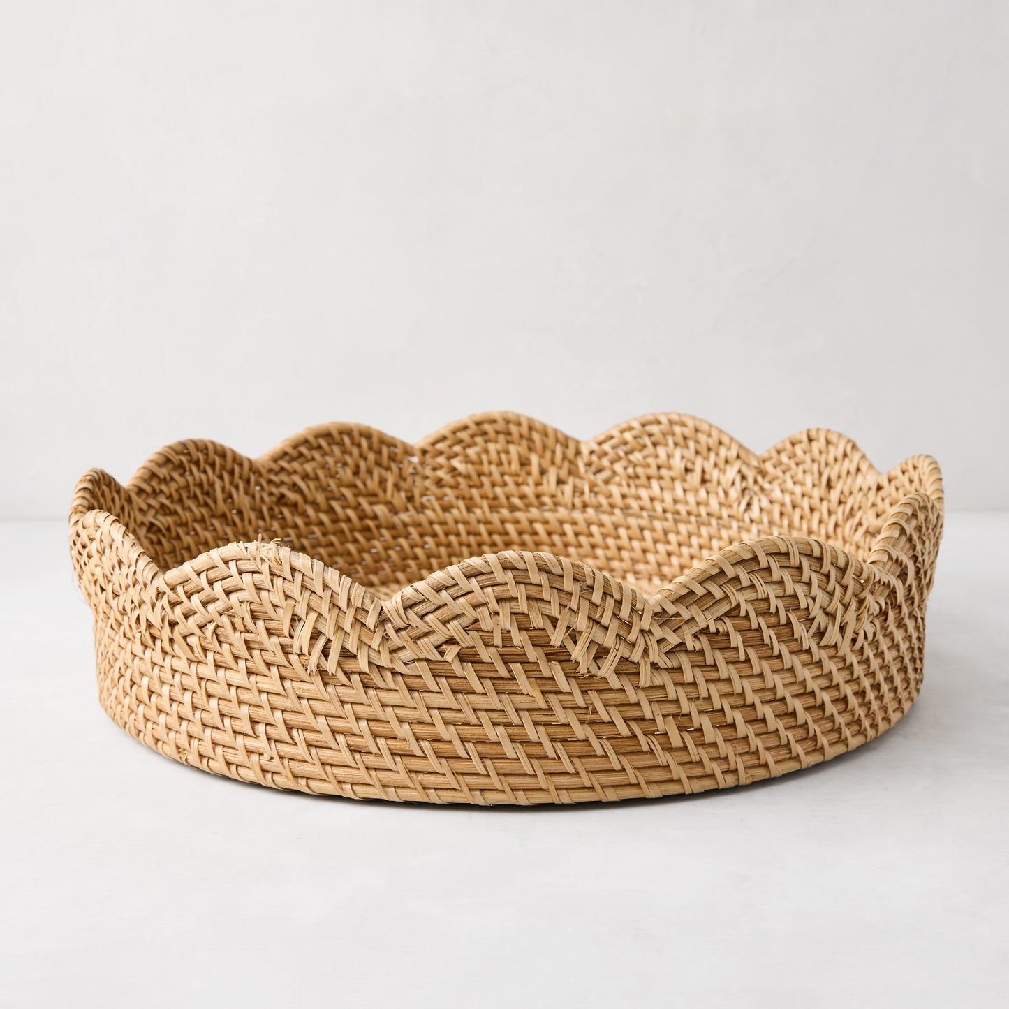 Cebu Scalloped Tray, 16"Dia, honey-brown hapao rattan, decorative curved edges.