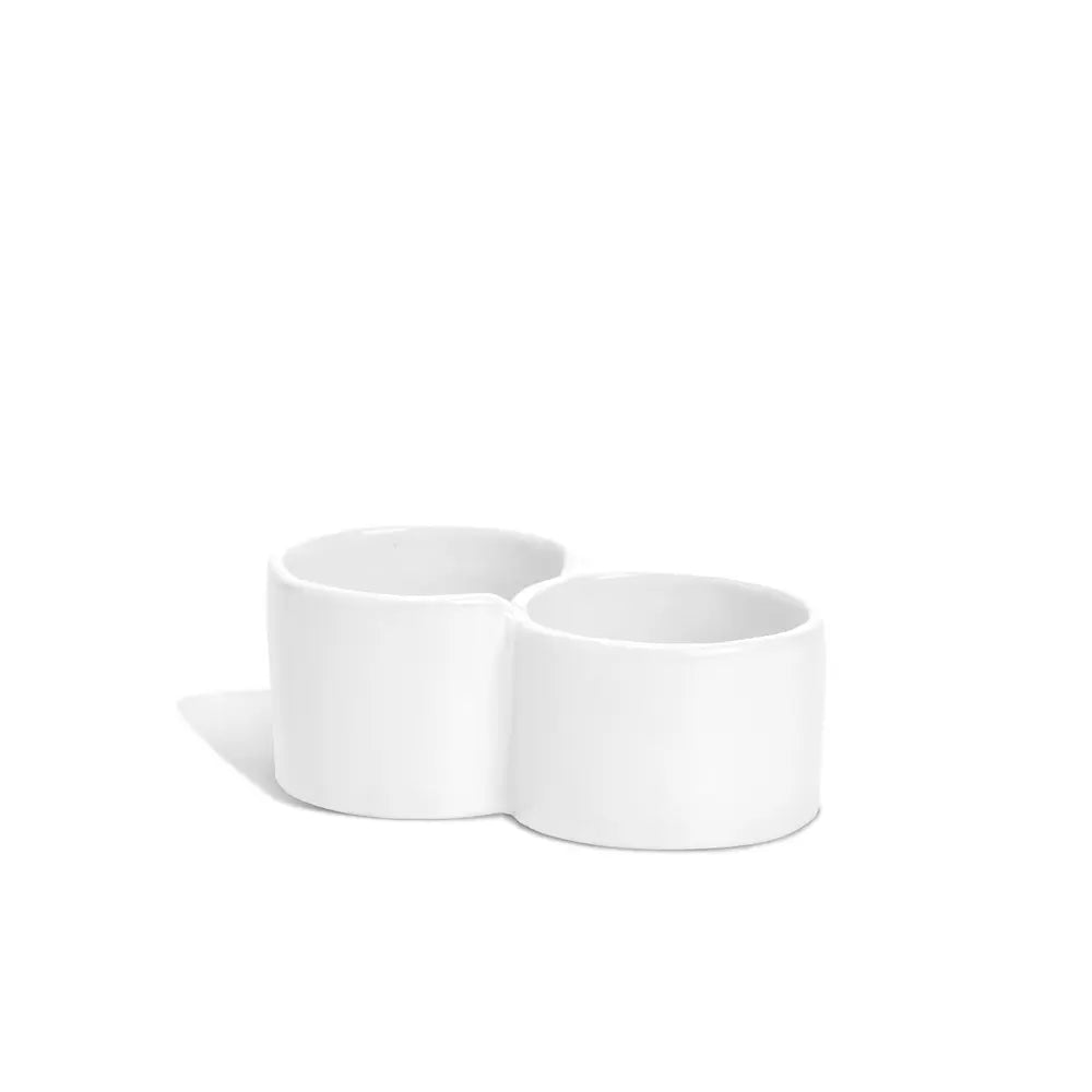 Creamy white ceramic double appetizer bowl by Montes Doggett, handmade in Peru.