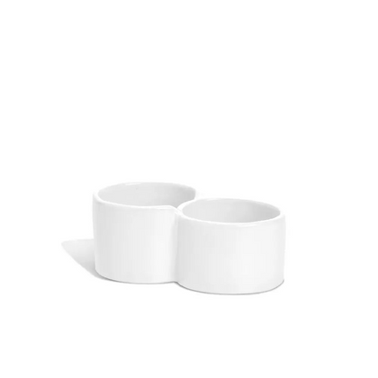 Creamy white ceramic double appetizer bowl by Montes Doggett, handmade in Peru.