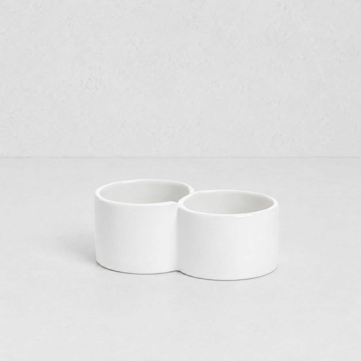 Creamy white ceramic double appetizer bowl by Montes Doggett, 6.25"Dia x 2.5"H.