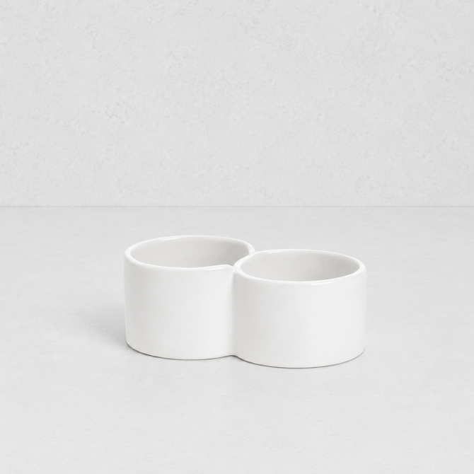 Creamy white ceramic double appetizer bowl by Montes Doggett, 6.25"Dia x 2.5"H.