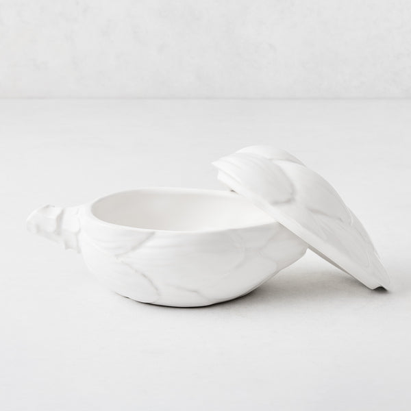 White ceramic artichoke-shaped lidded bowl with detailed leaf texture, 7.68 inches long, made in Italy.