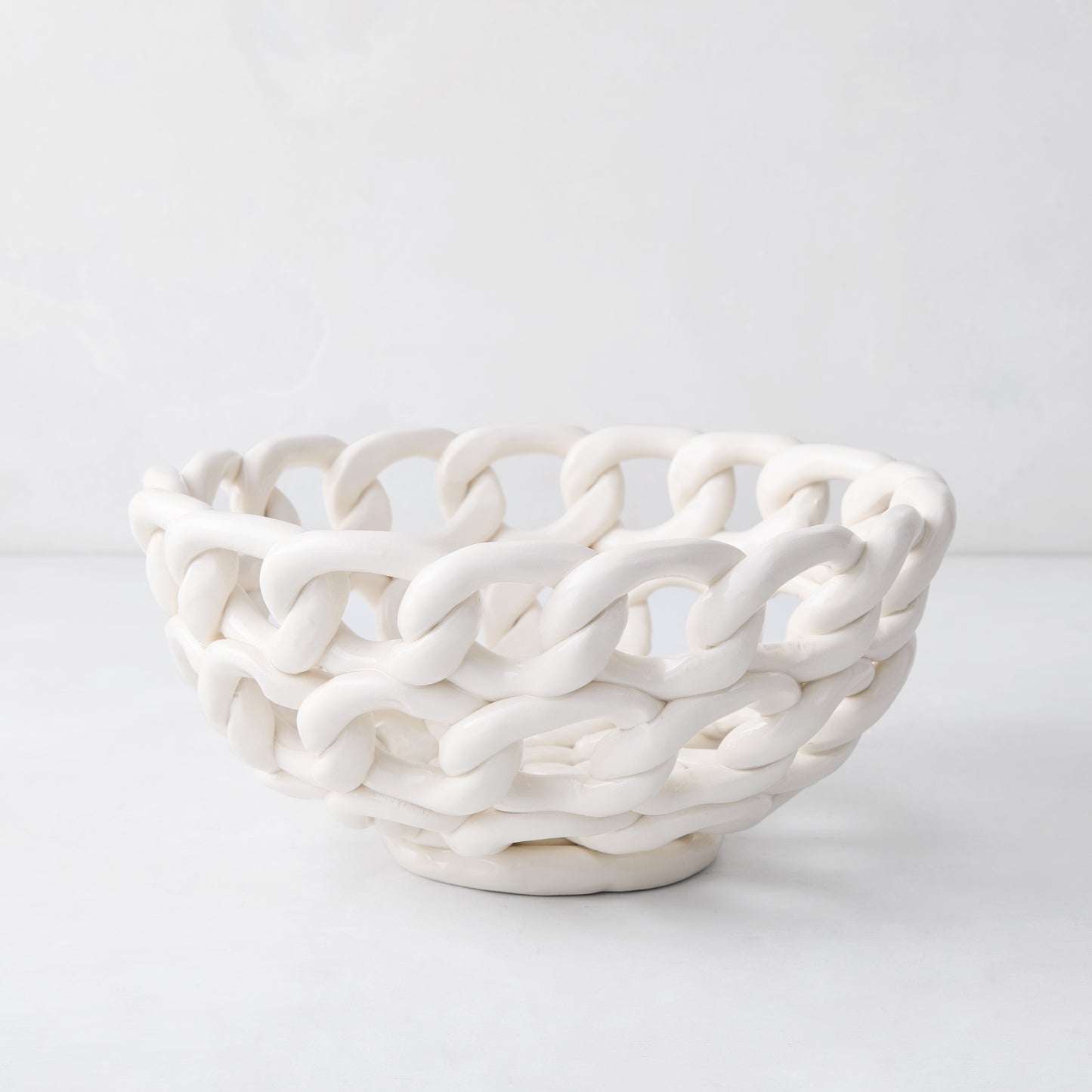 White ceramic woven bread serve bowl, 9.25"Dia x 4.25"H, handmade in Italy.