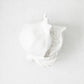 Handmade white glazed ceramic pomegranate decorative sculpture with artisanal details, 11 inches long.