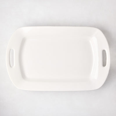 White ceramic serving platter with elegant handles, 13"W x 21"L, high-fired earthenware.