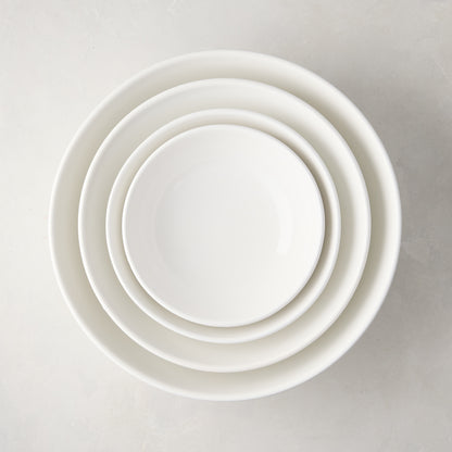 Set of 4 white ceramic nesting serve bowls, handmade in Italy.