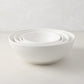 Set of 4 white ceramic nesting serve bowls, handmade in Italy, for salads, pastas, and snacks.