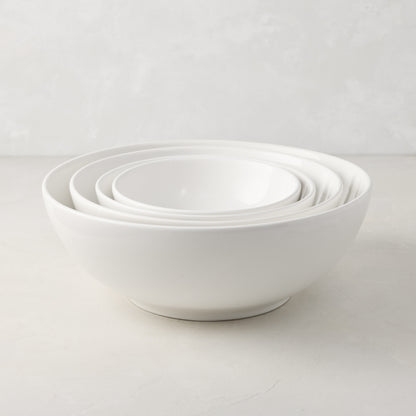 Set of 4 white ceramic nesting serve bowls, handmade in Italy, for salads, pastas, and snacks.