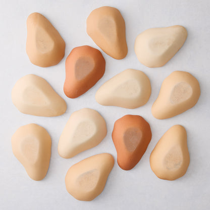 Set of 12 handmade ceramic oyster shells in varying shades of tan and brown, 3.14” L x 2” W.