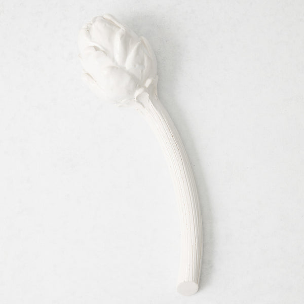 Handmade white ceramic Roman artichoke stem with artisanal details, 11 inches long, on a white background.