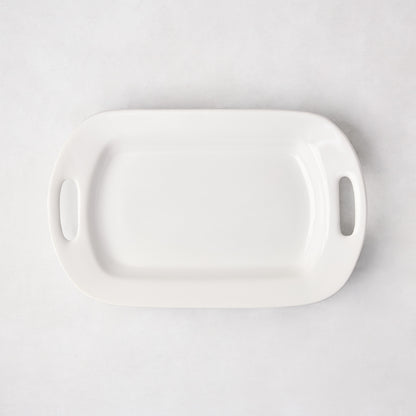 White ceramic small handled serving platter, 15"L x 9"W, with elegant handles.
