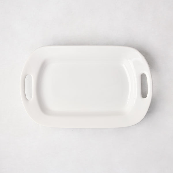 White ceramic small handled serving platter, 15"L x 9"W, with elegant handles.