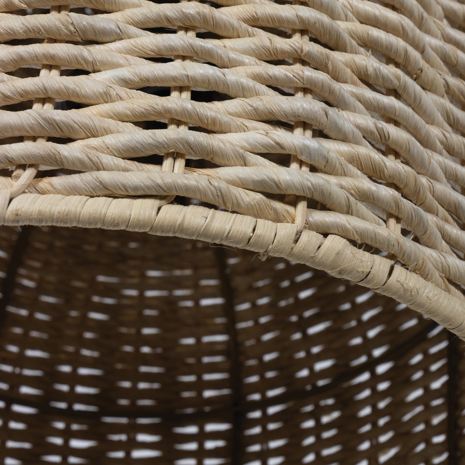Close-up of a dome-shaped Champagna pendant light shade made of natural rattan-like material.