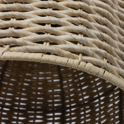 Close-up of a dome-shaped Champagna pendant light shade made of natural rattan-like material.