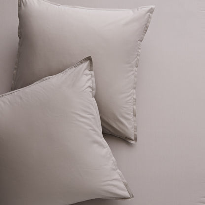 Two Charcoal Grey Italian Percale Euro Shams with envelope closures, shown on matching bedding.