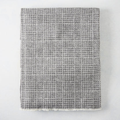Charcoal grey Sutton Houndstooth throw blanket, 51"W x 67"L, cotton-acrylic blend with raw edge.