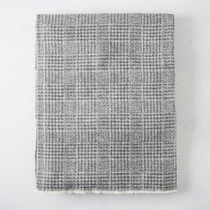 Charcoal grey Sutton Houndstooth throw blanket, 51"W x 67"L, cotton-acrylic blend with raw edge.