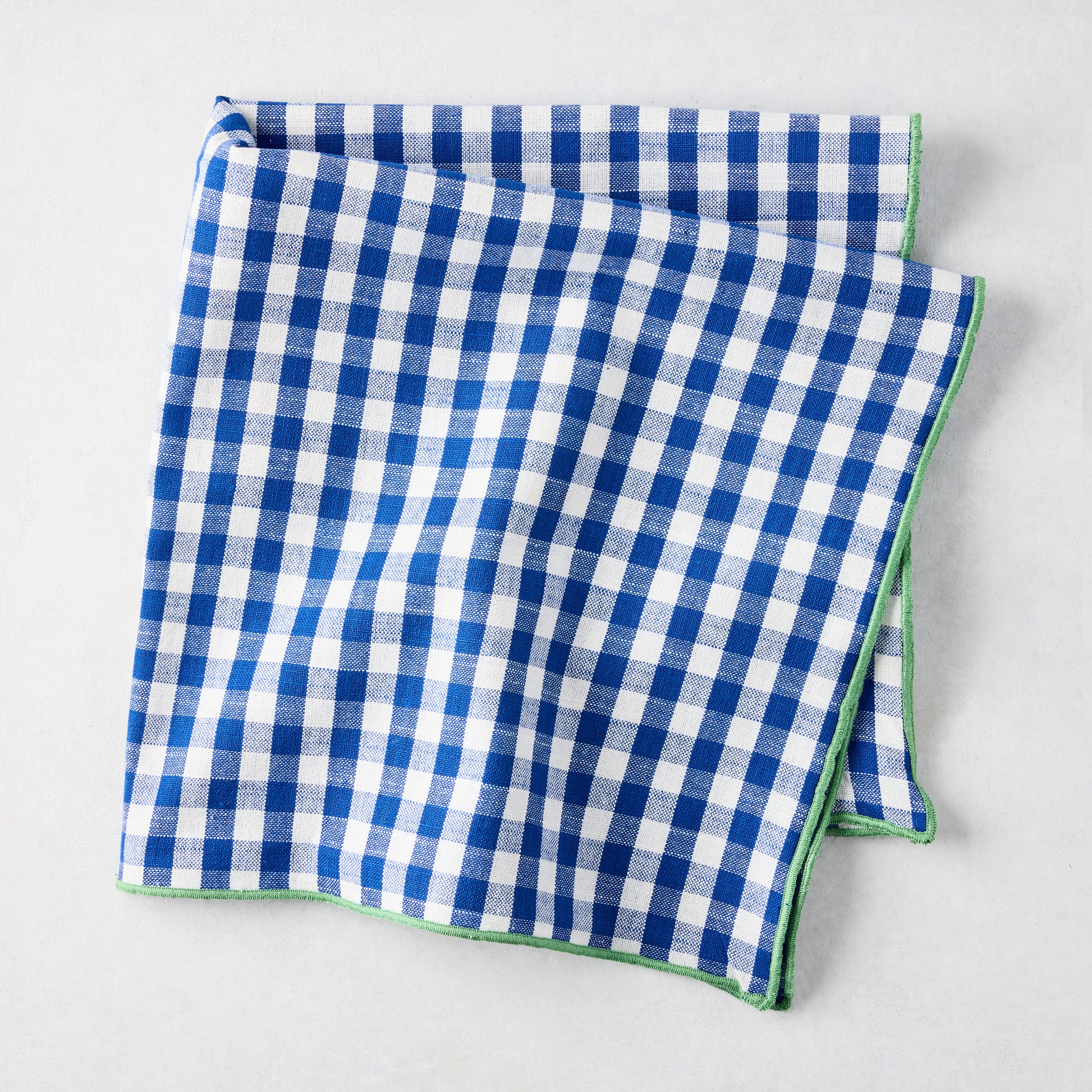 Chatham Blue Gingham Cotton Napkin, 22" square, with green embroidered trim.
